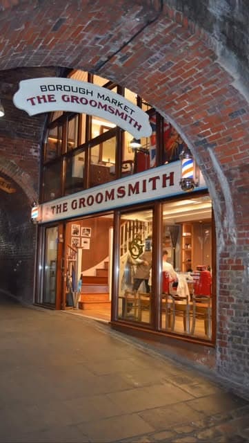 Borough Market arch with The Groomsmith sign and festive lights